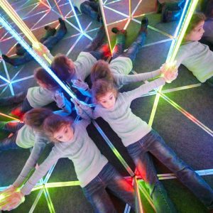 Child enjoying a mirror maze Fun Maze